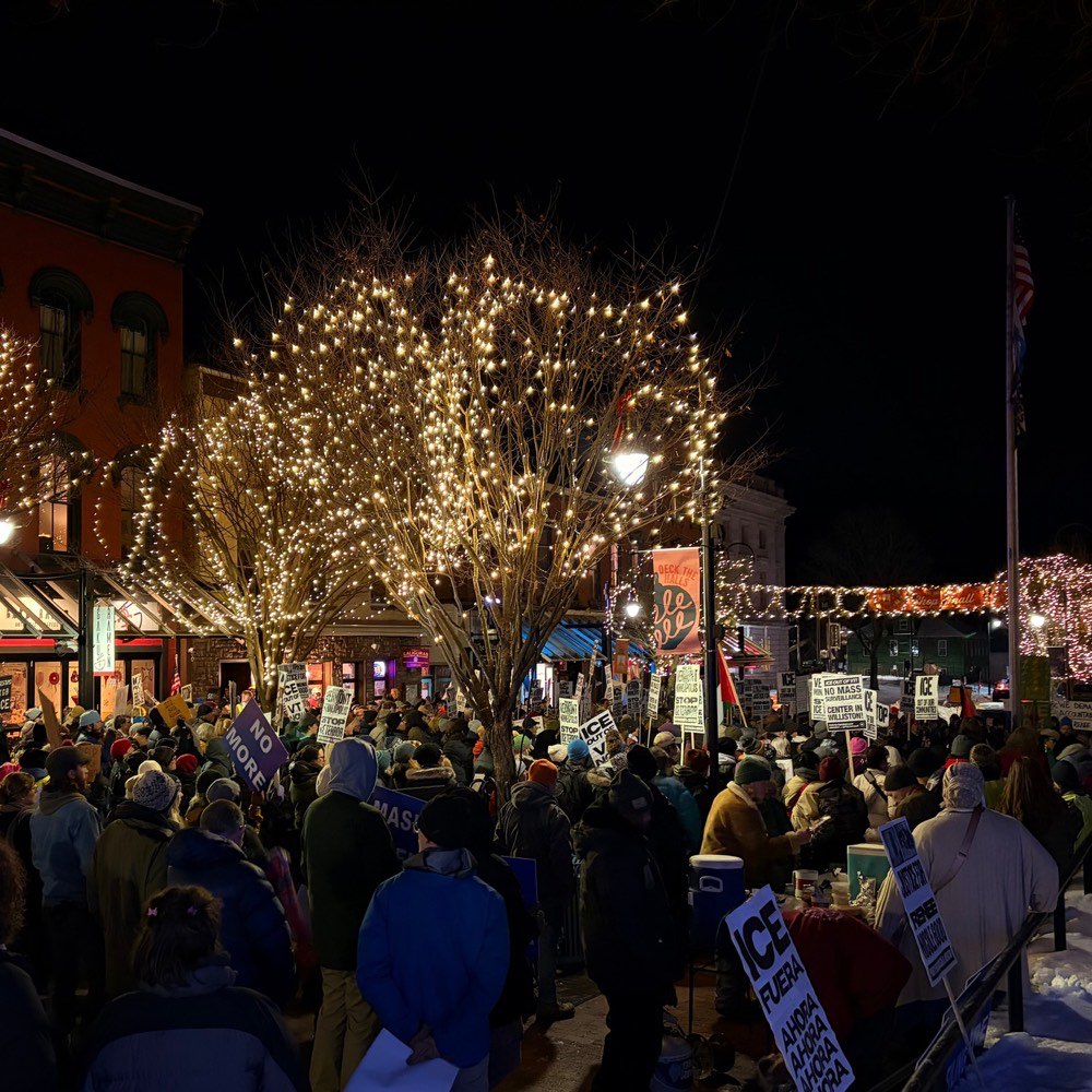 A crowd under the string lights on Church Street
